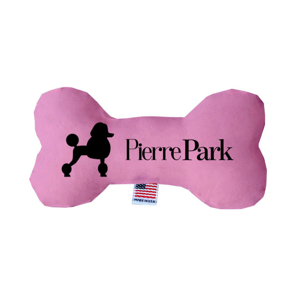 A bright pink bone-shaped toy by PierrePark features a poodle silhouette and brand text. It includes an American flag tag at the bottom.