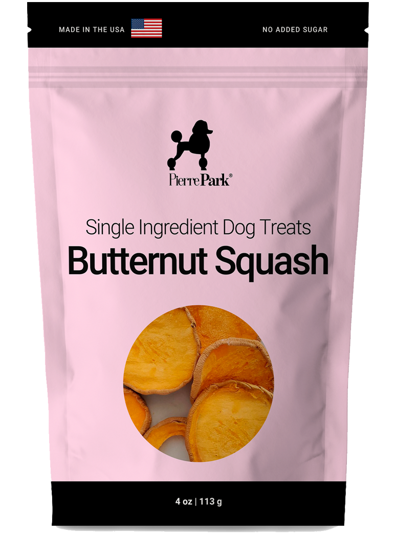 A pink bag labeled Single Ingredient Dog Treats: Butternut Squash featuring an image of sliced butternut squash. The package is 4 oz (113 g) and includes the text Made in the USA and No Added Sugar.