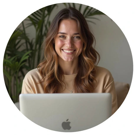 Smiling woman using a MacBook to place an order online.