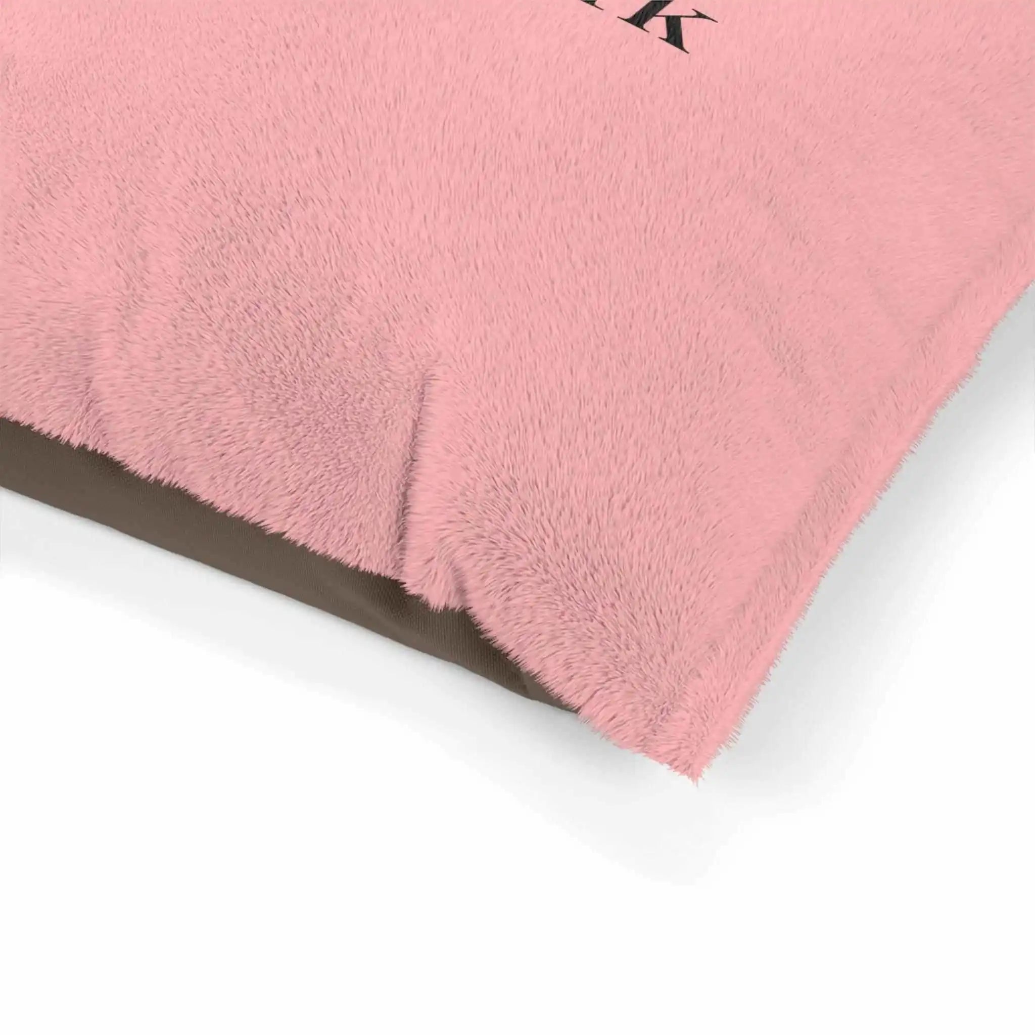 A close-up view of a soft pink dog bed cushion with the PierrePark logo, showcasing the plush texture and comfortable design ideal for pets.