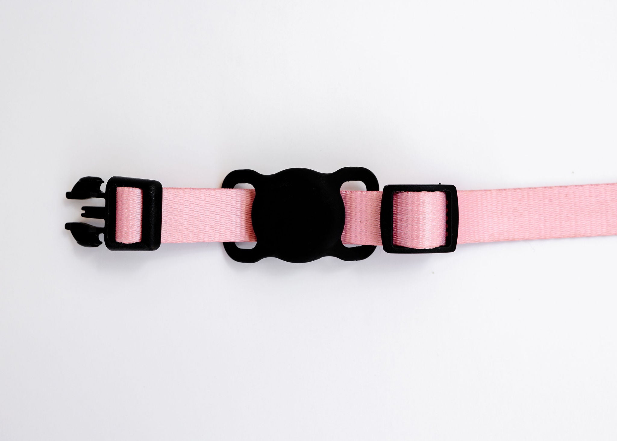 The PierrePark Pink Dog Collar, featuring an unfastened black plastic buckle and adjustable strap, is displayed against a white background.