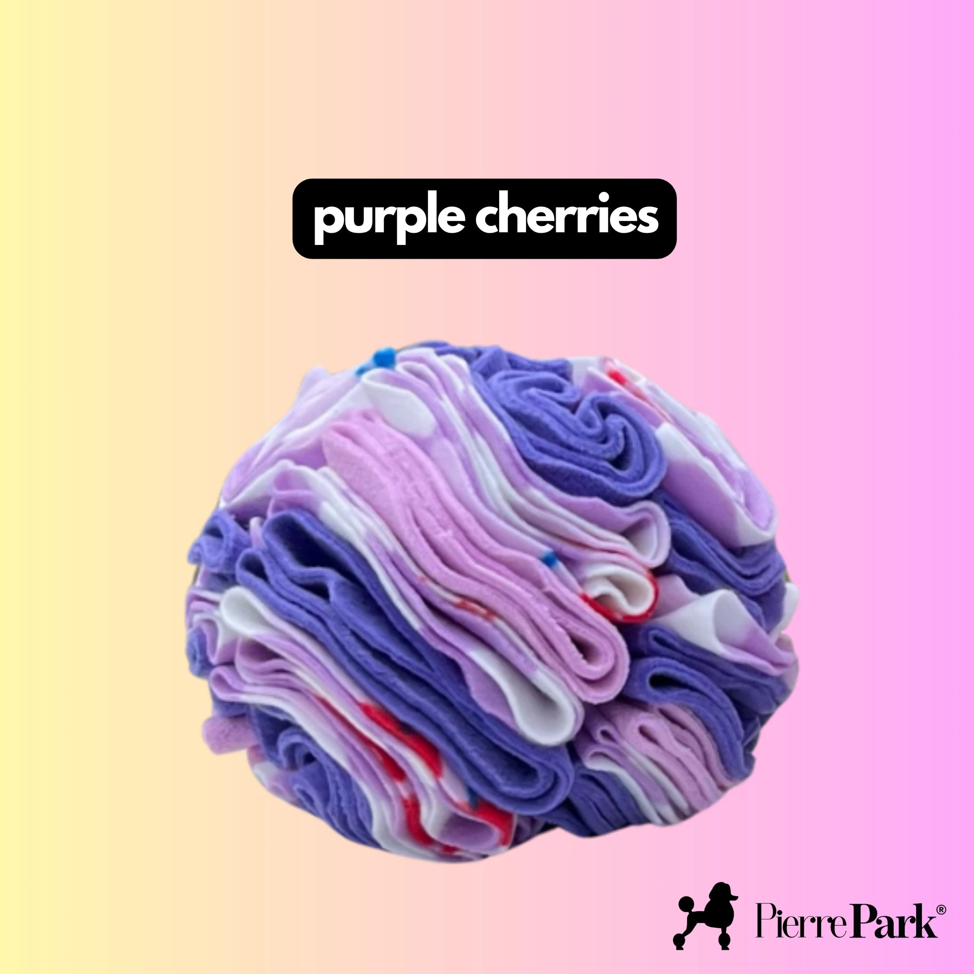 Snuffle ball for dogs by PierrePark in shades of purple, pink, and white, with the label 'purple cherries' on a pastel yellow and pink gradient background. Designed to stimulate a dog's natural foraging instincts.