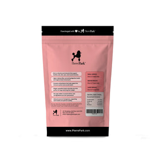 Back view of a PierrePark sweet potato hypoallergenic dog treats package in pink, displaying nutritional information and feeding guidelines for small, medium, and large breeds. The package highlights benefits such as no sugar added and high in dietary fiber, along with the brand's website, www.PierrePark.com, and contact details.