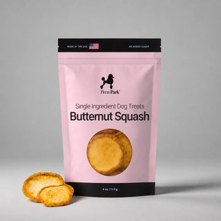 Pink 4 oz bag of PierrePark Butternut Squash Dog Treats with two dried butternut squash slices in front.