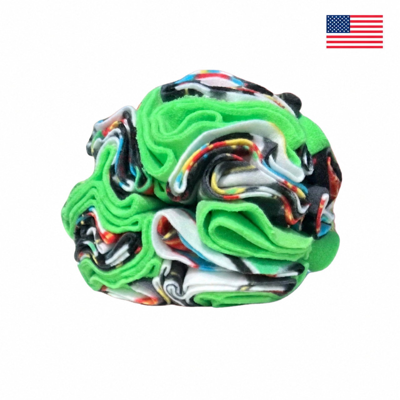 Green Games snuffle ball for dogs on a white background with a small American flag in the upper-right corner.